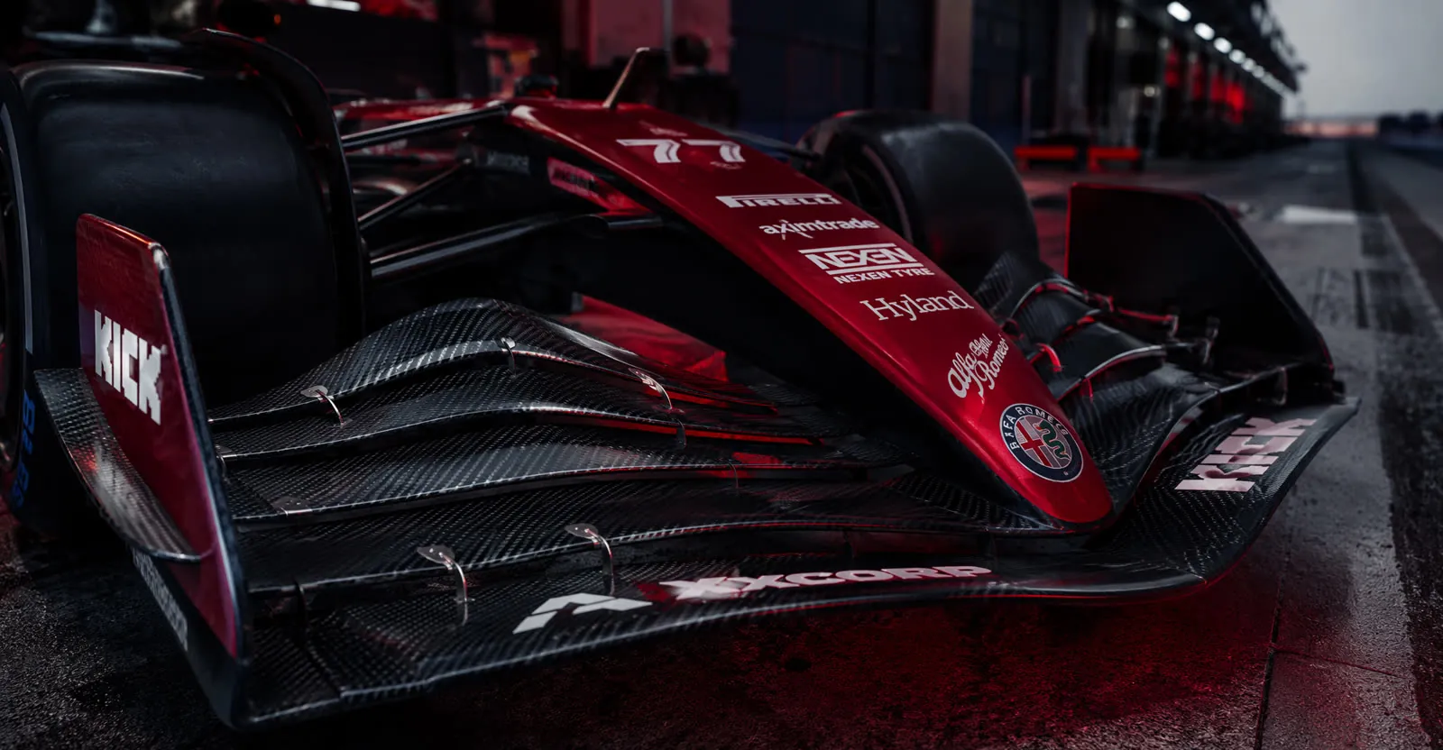 Close-up of Formula 1 car front wing with red racing livery